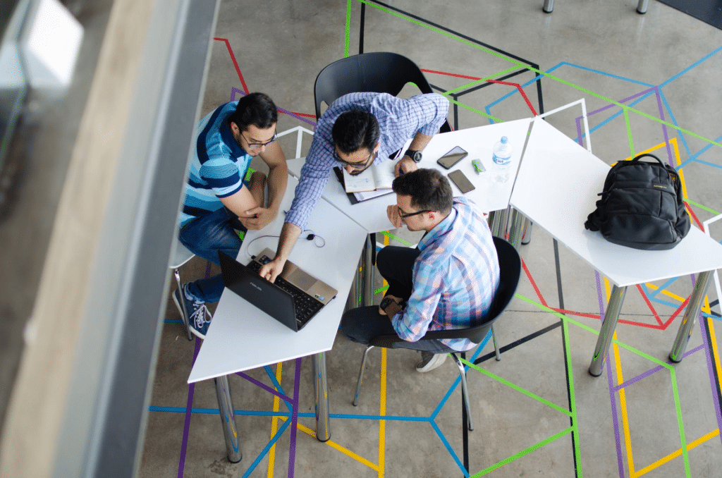 Startup employees working at laptop