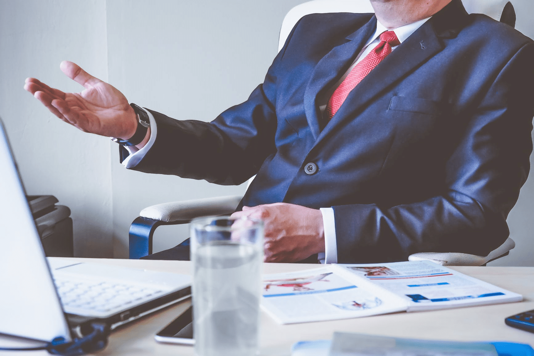 Man in suit gesturing